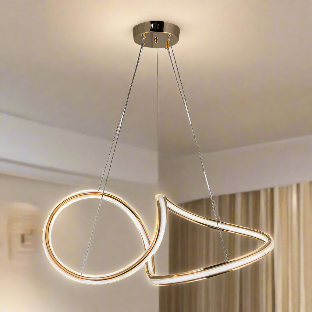 Modern pendant light with gold and white design on a white background
