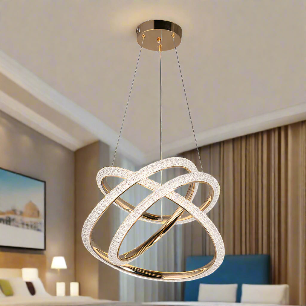 Decorative ceiling light fixture with gold and crystal design on a white background