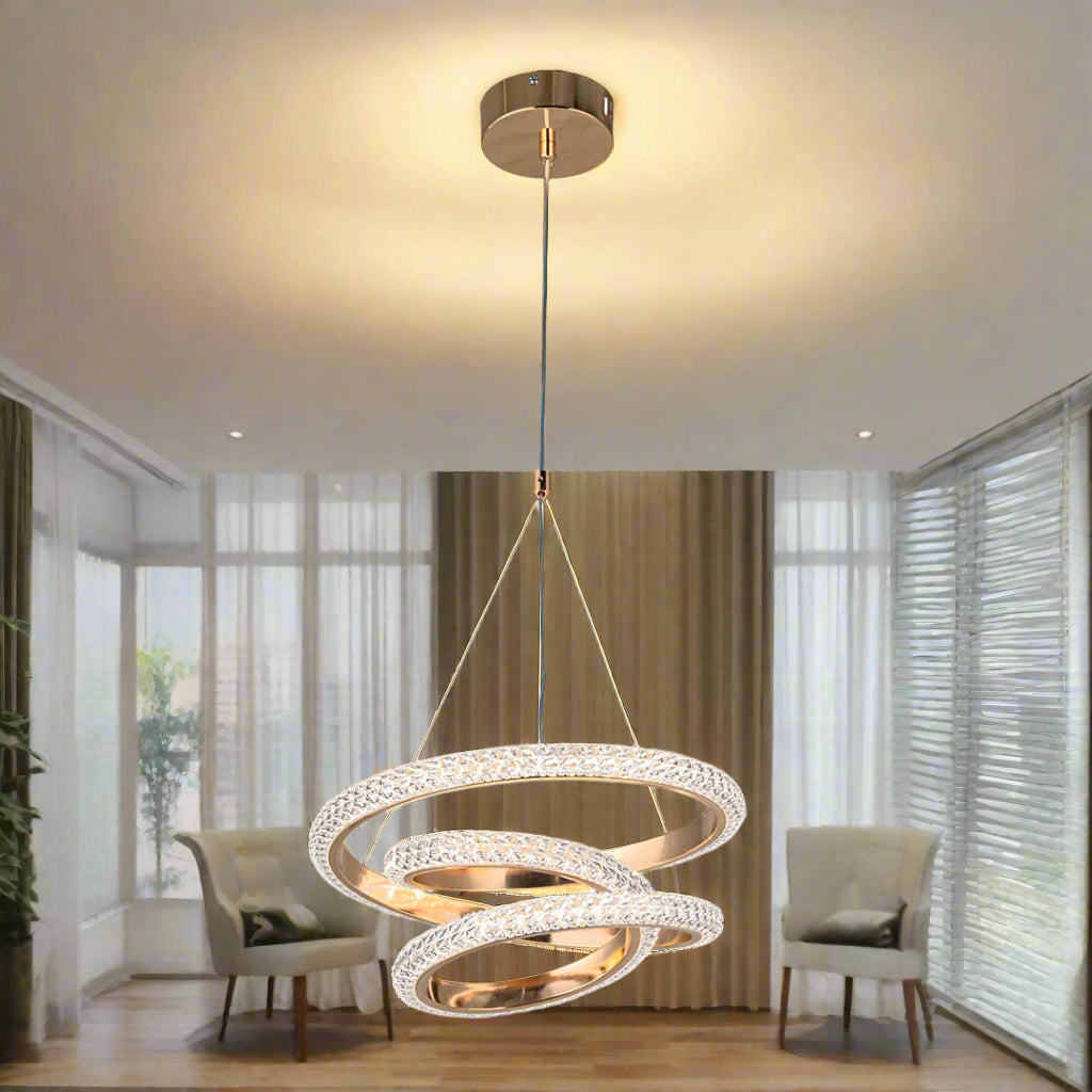 Gold spiral pendant light on a white background