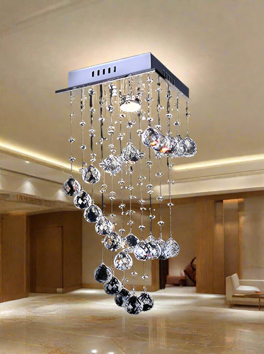 Crystal chandelier with dangling glass balls on a black background