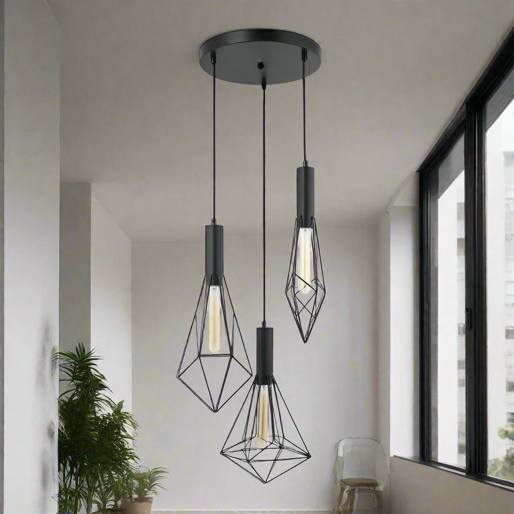 Modern pendant light with geometric black metal shades on a white background