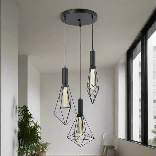 Modern pendant light with geometric black metal shades on a white background