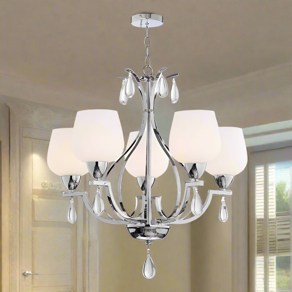 Chandelier with white lampshades and crystal accents on a white background