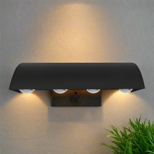 Black range hood with four lights on a white background