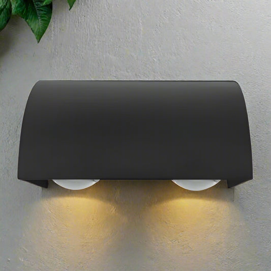 Black rectangular object with rounded edges on a white background